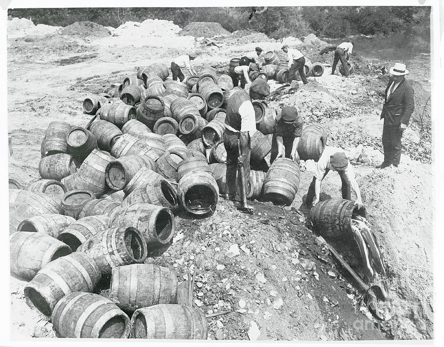 Workers Spilling Seized Beer Photograph by Bettmann