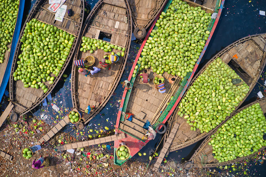Workers Unload Watermelons From The Boats Using Big Baskets Photograph by Azim Khan Ronnie