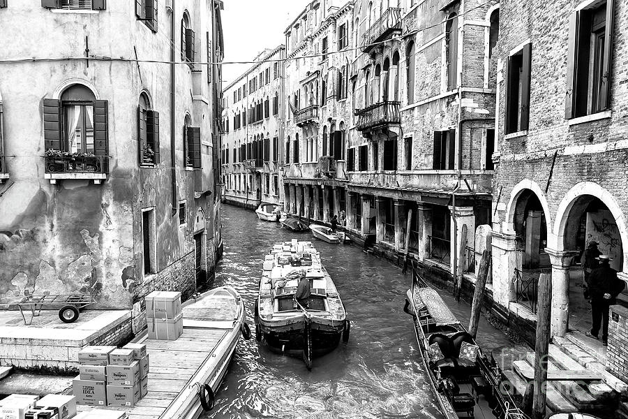 Working on the Canal in Venice Photograph by John Rizzuto