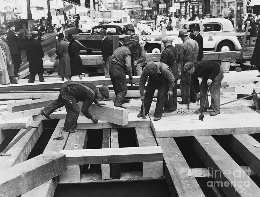 Workmen Laying Crossbeams Photograph by Bettmann