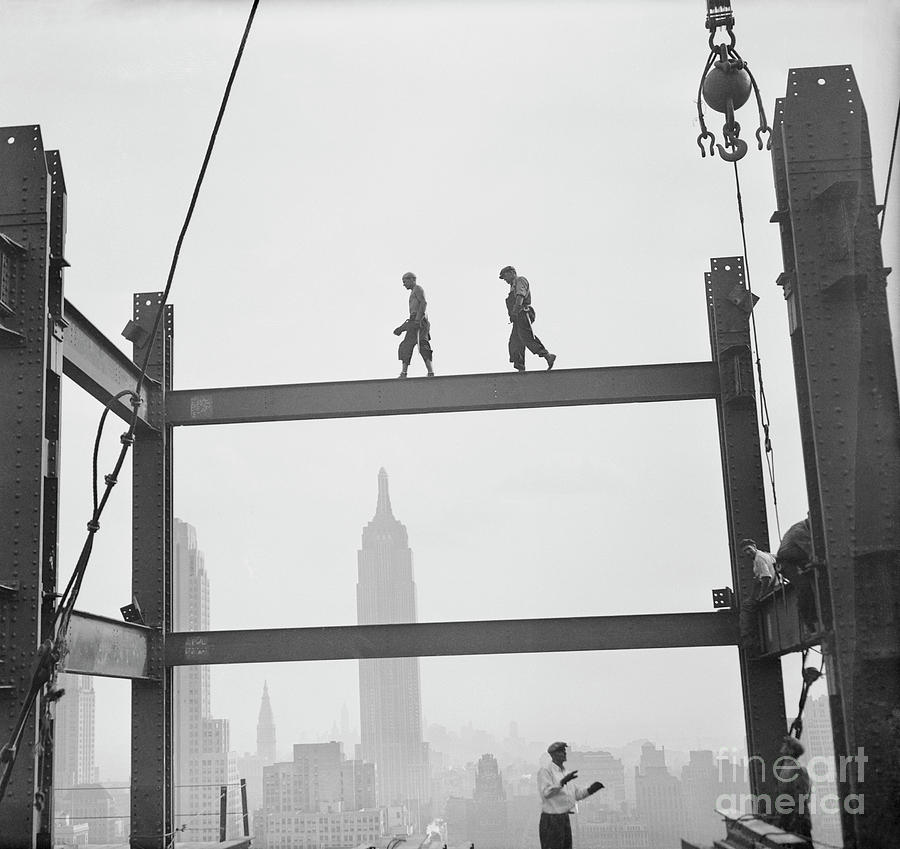 Workmen Walking Along Girders Photograph by Bettmann