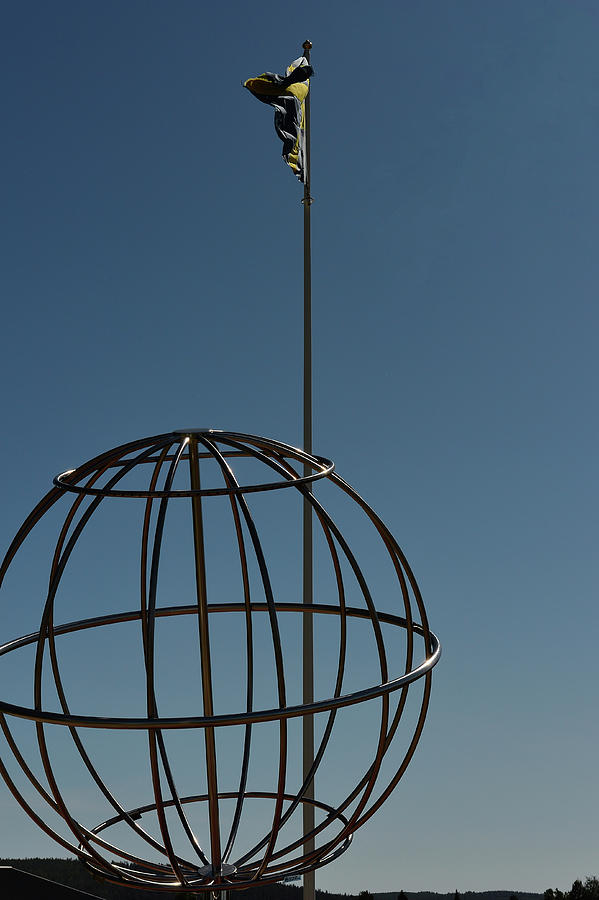 Summer Photograph - World Globe And Flagpole At The Arctic Circle, Norrbottens Ln, Sweden by Torsten Rathjen