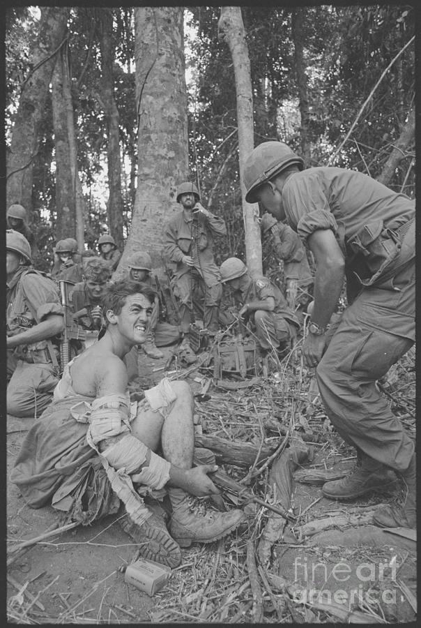 Wounded Soldier Awaiting Evacuation Photograph by Bettmann