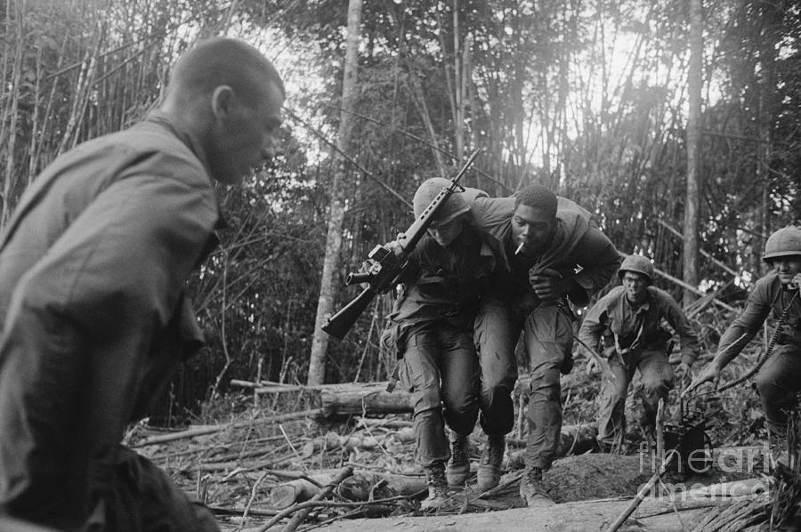 Wounded Soldier Being Carried To Safety Photograph by Bettmann