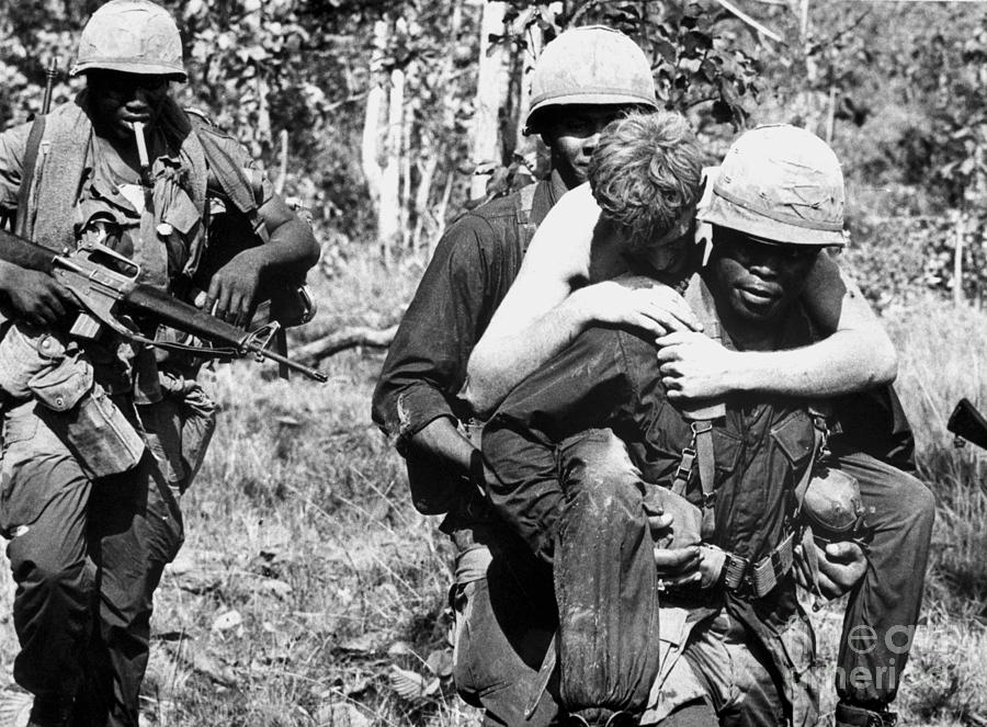 Wounded Soldier Getting Piggy Back Ride Photograph by Bettmann