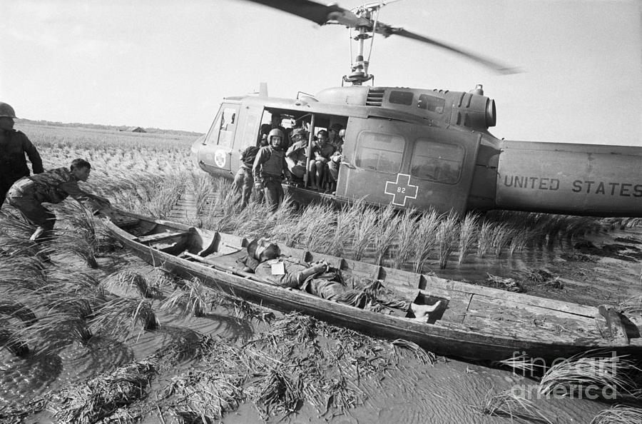 Helicopter Photograph - Wounded South Vietnamese Taken To Copter by Bettmann