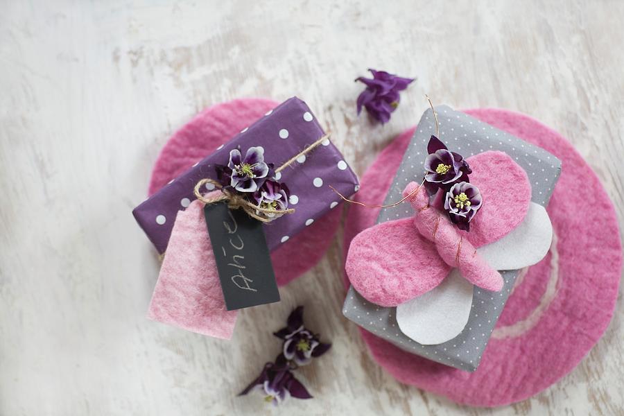 Wrapped Gifts Decorated With Flowers, Hand-made Tags And Felt Butterflies On Pin Mats Photograph by Alicja Koll