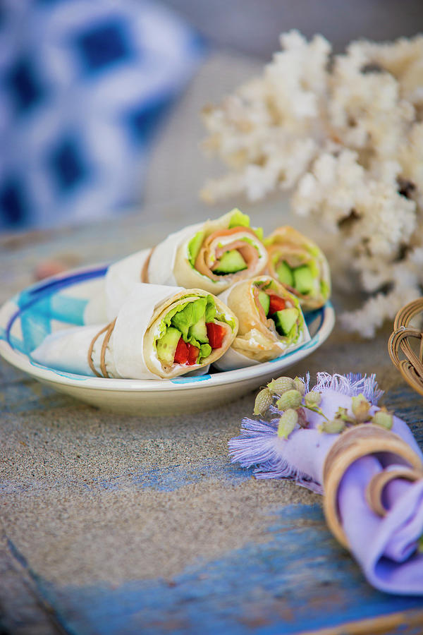 Wraps In Parchment Paper On Plate On Table Set In Mediterranean Style Photograph by Bildhbsch