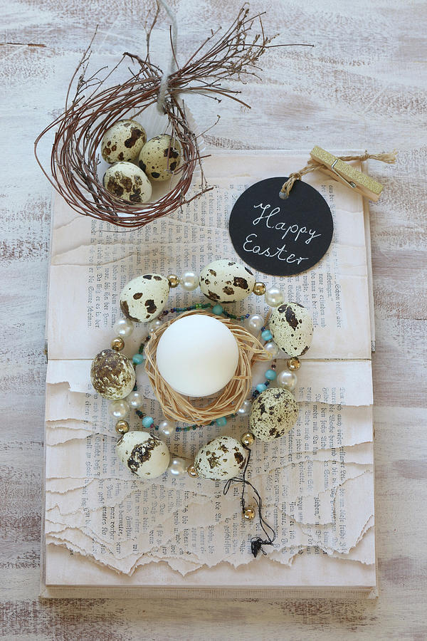 Wreath Of Beads And Quail Eggs On Book With Torn Pages Photograph by Regina Hippel