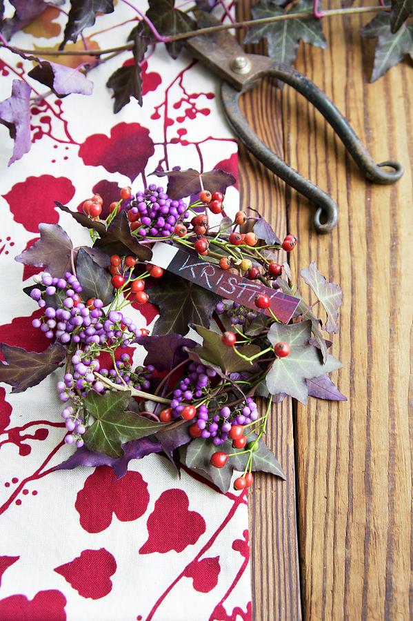 Wreath Of Callicarpa, Tiny Rosehips And Purple Ivy With Name Tag Photograph by Martina Schindler