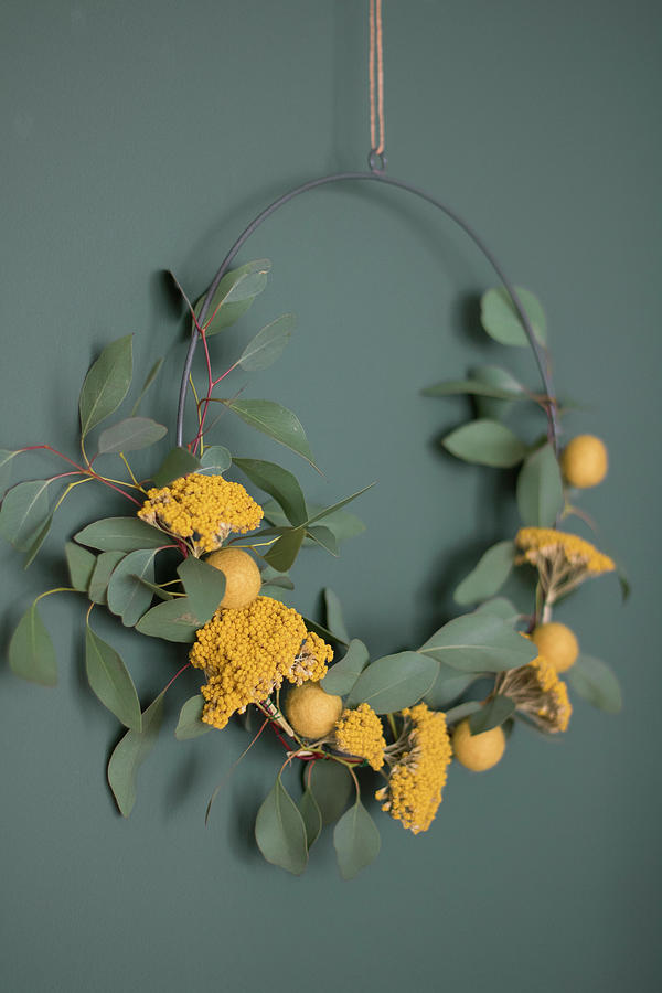 Wreath Of Eucalyptus Twigs, Yarrow And Yellow Felt Balls Photograph by Marij Hessel