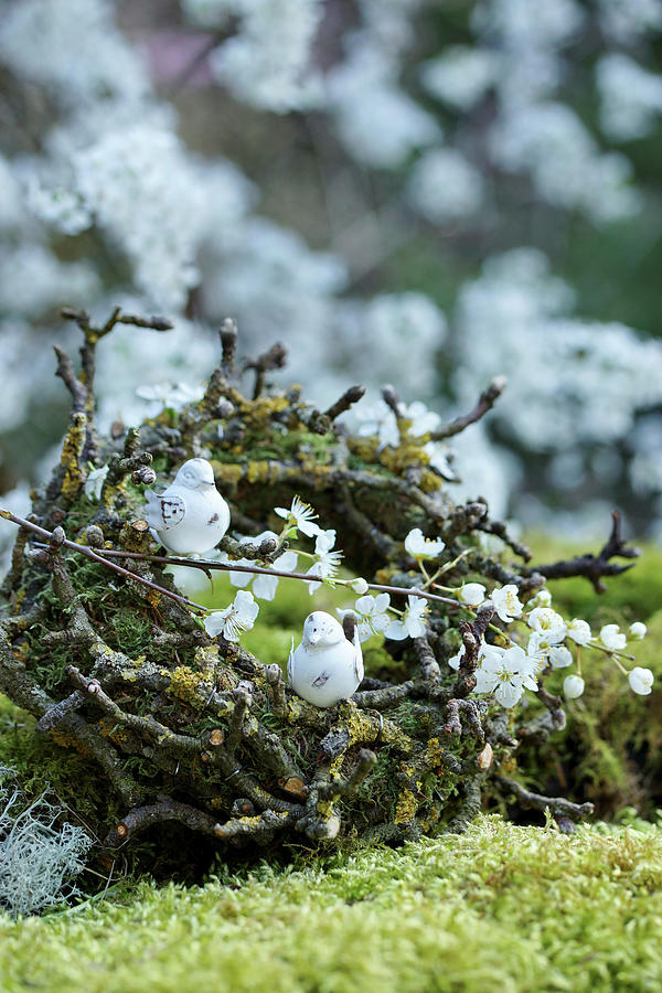 Wreath Of Moss And Twigs Decorated With Bird Figurines And Flowering Branches Photograph by Angelica Linnhoff