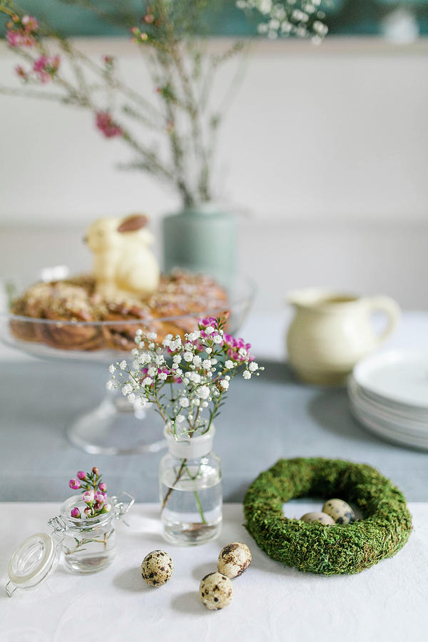 Wreath Of Moss, Quail Eggs And Spring Flowers In Jars Photograph by Sabine Steffens