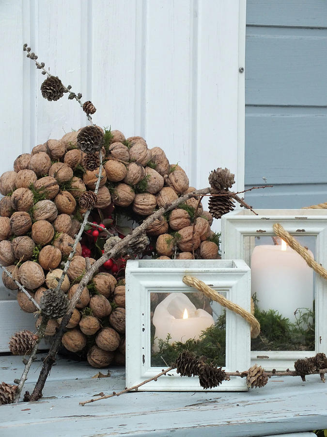 Wreath Of Walnuts And Candle Lanterns Photograph by Susan Haag