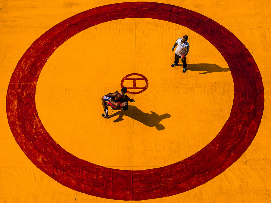 Wrestle In Circle Of Yellow Photograph by Amit Paul