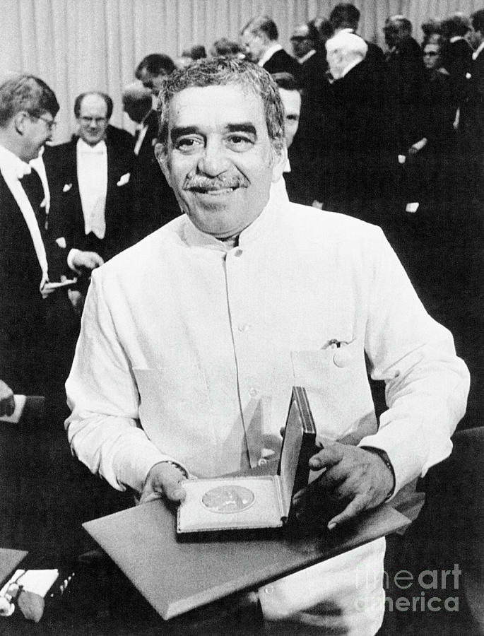 Writer Gabriel Garcia Marquez Holding Photograph by Bettmann