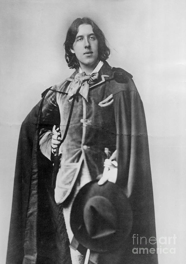 Writer Oscar Wilde Wearing Cape Photograph by Bettmann
