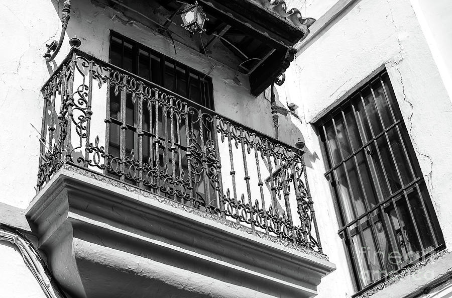 Architecture Photograph - Wrought Iron Balcony in Seville by John Rizzuto