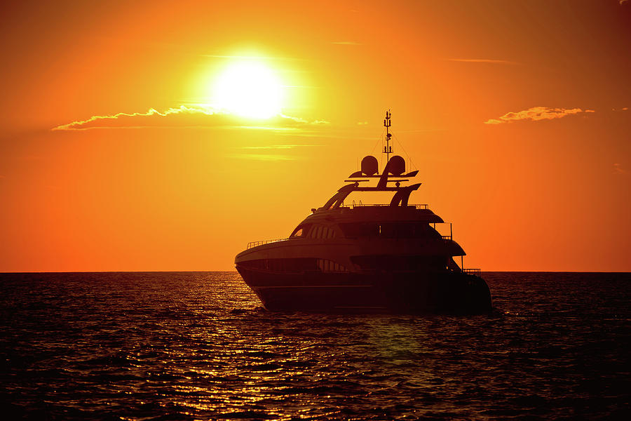 Yachtig on open sea at golden sunset view Photograph by Brch Photography