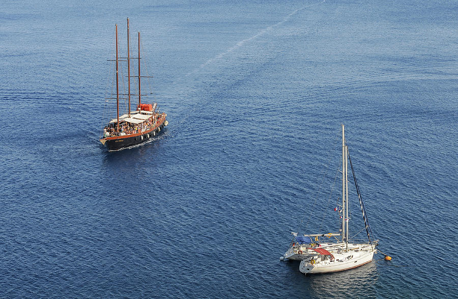 Yachts sailing on a blue calm sea Photograph by Michalakis Ppalis