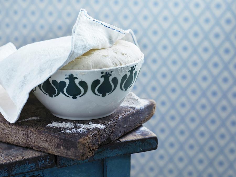 Yeast Bread Dough In A Bowl Under A Teatowel Photograph by Mikkel Adsbl