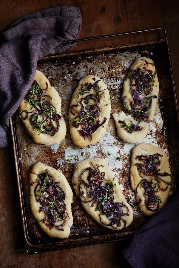 Yeast Bread Topped With Red Onions On A Baking Tray Photograph by Ulrika Ekblom