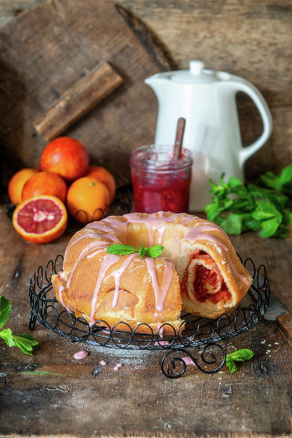 Yeast Cake With Blood Orange Jam Filling And Glaze Photograph by Irina Meliukh