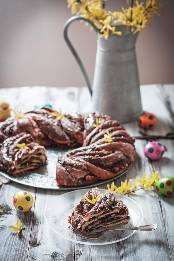 Yeast Dough Wreath Filled With Chocolate Spread And Nuts For Easter Photograph by Cau De Sucre