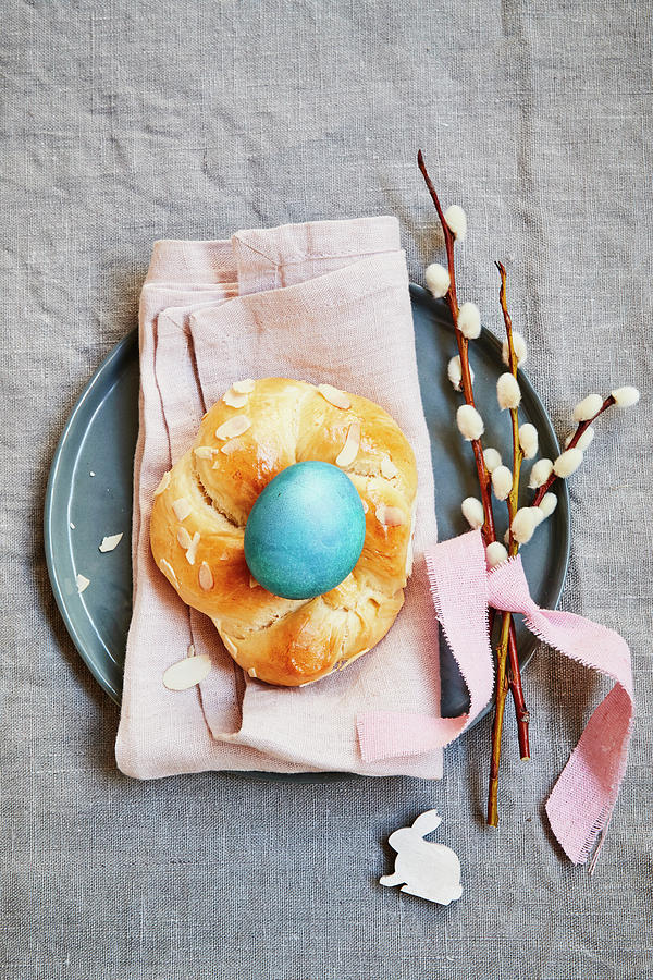 Yeast Dough Wreath With A Blue Coloured Egg And Pussy Willow Photograph by Brigitte Sporrer