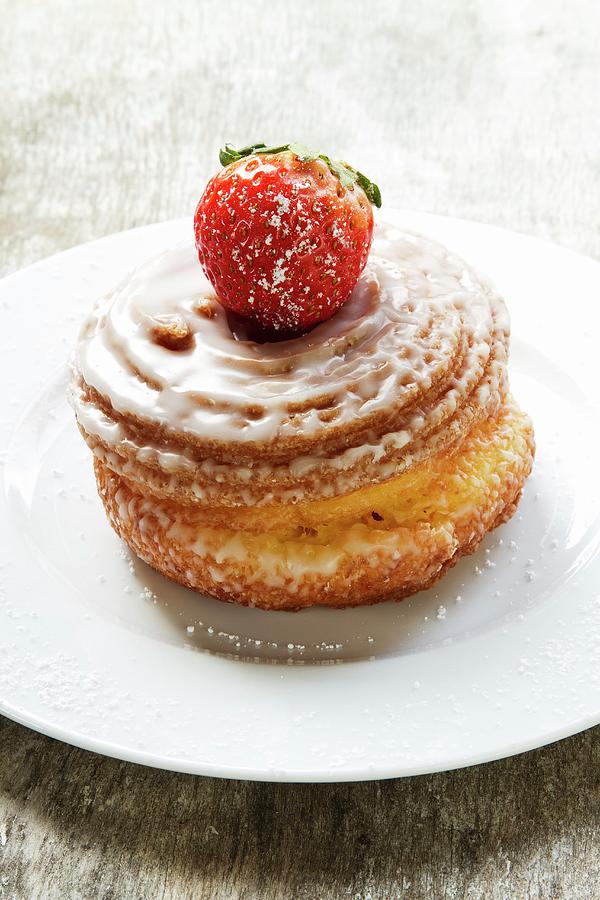 Yeast-raised Pastry Whirl With Sugar Glaze And A Strawberry Photograph by Vedder, Catja