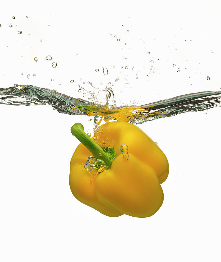 Yellow Bell Pepper Splashing Photograph by Don Farrall