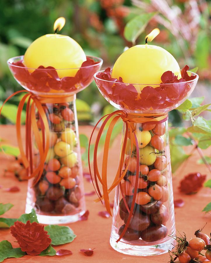 Yellow Candles On Glasses Filled With Rose Hips & Chestnuts Photograph by Strauss, Friedrich