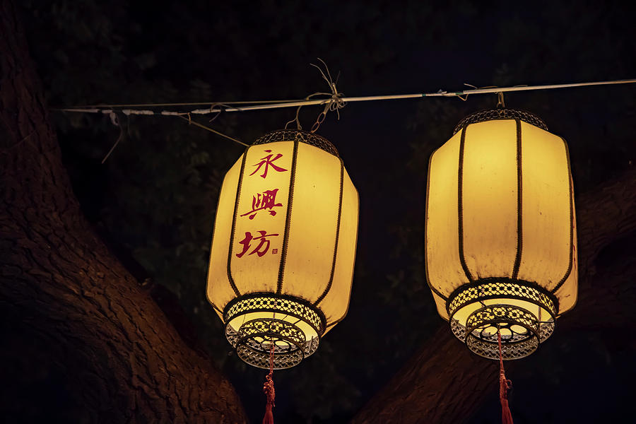 Yellow Chinese lanterns illuminated at night Photograph by Karen Foley