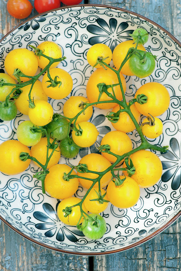 Yellow Grape Tomatoes In A Bowl Photograph by Spyros Bourboulis