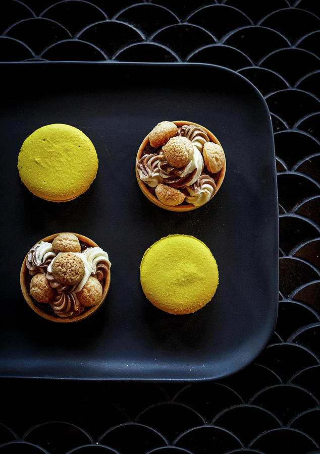Yellow Macarons And Almond Chocolate Tarts Photograph by The Kate Tin