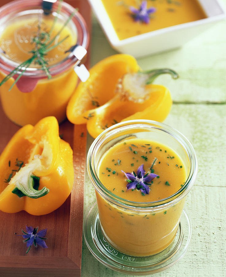 Yellow Pepper Soup With Borage Flowers In Jars Photograph by Teubner Foodfoto