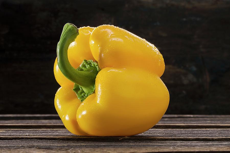 Yellow Pepper With Drops Of Water Photograph by Christian Schuster