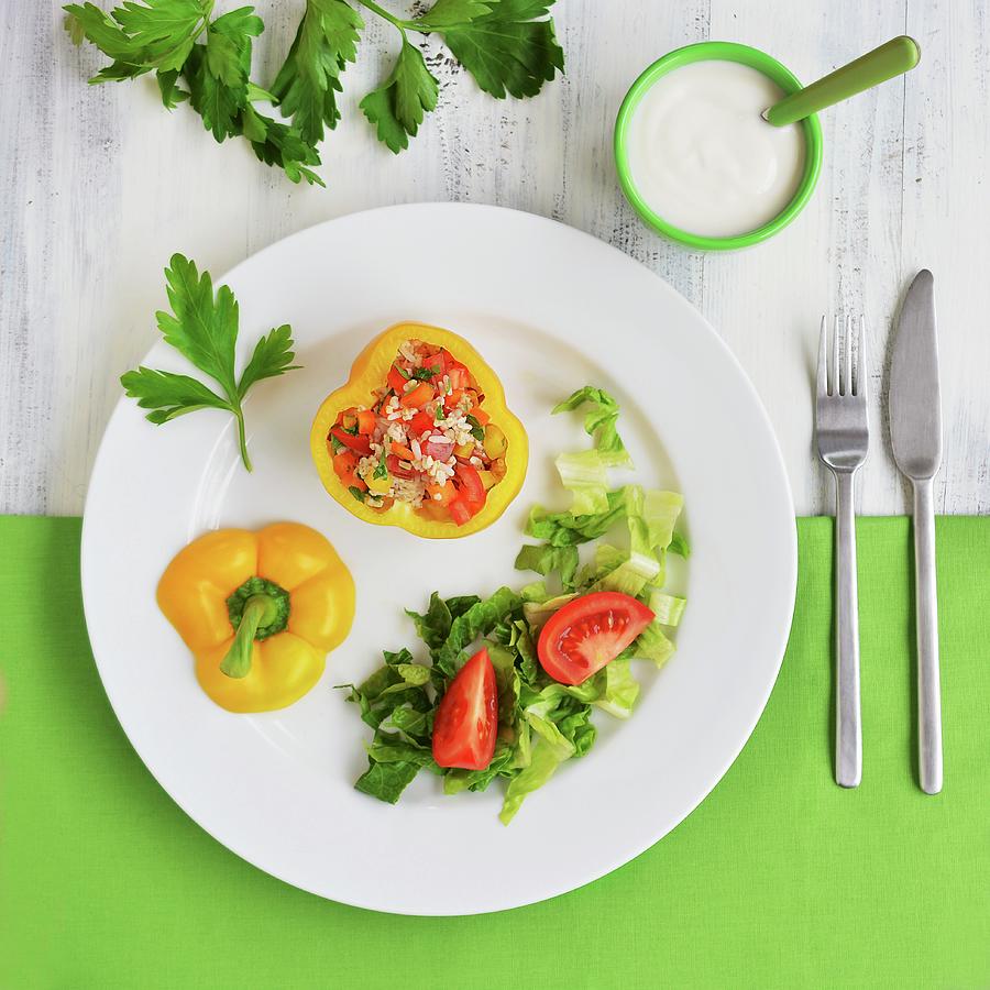 Yellow Peppers Filled With A Rice, Pepper And Tomato Salad Photograph by Mariola Streim