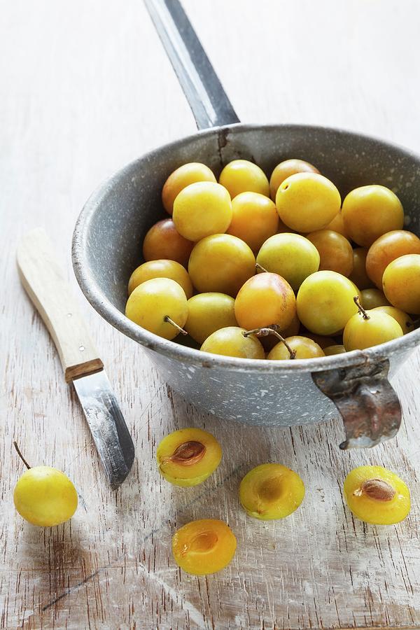 Yellow Plums In A Sieve Photograph by Eva Grndemann