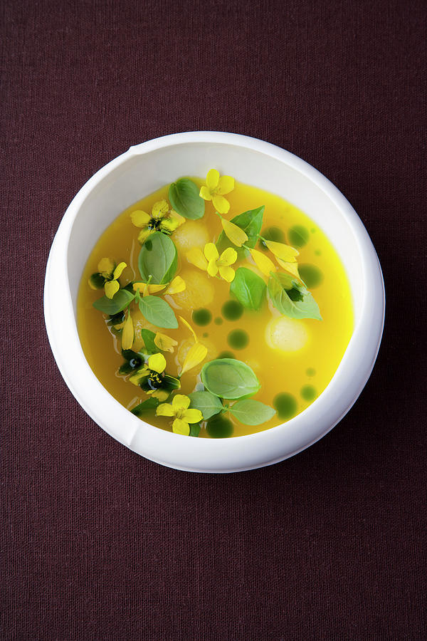 Yellow Watermelon Gazpacho With Basil Oil Photograph by Michael Wissing