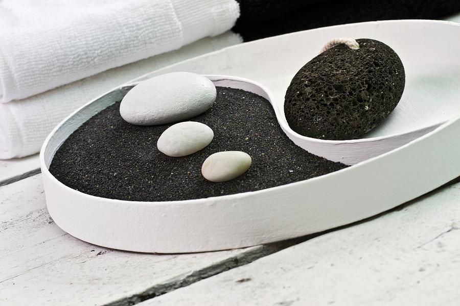 Yin And Yang Dish With Black Pumice And White Pebbles Photograph by Uwe Merkel