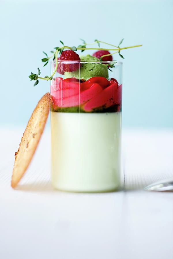 Yoghurt And Thyme Panna Cotta With Raspberry Foam And Herb-honey Sorbet In A Glass Photograph by Michael Wissing