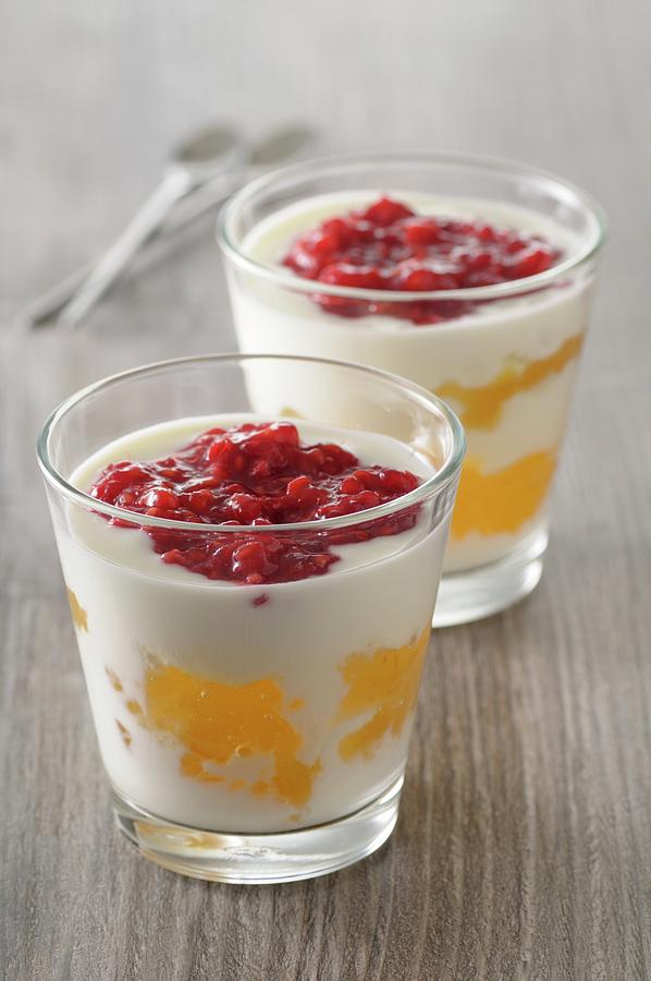 Yoghurt Desserts With Lemon Curd And Raspberry Puree Photograph by Jean-christophe Riou