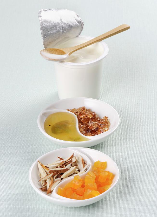 Yoghurt, Honey, Rock Sugar, Coconut And Candied Fruit Photograph by Franco Pizzochero