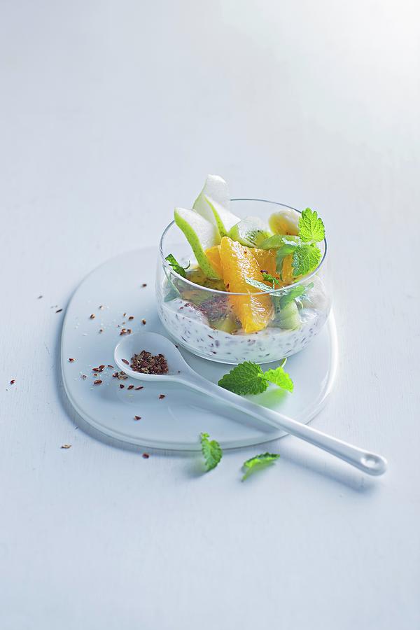 Yoghurt With Fruit, Flax Seeds And Lemon Balm Photograph by Jalag / Stefan Bleschke