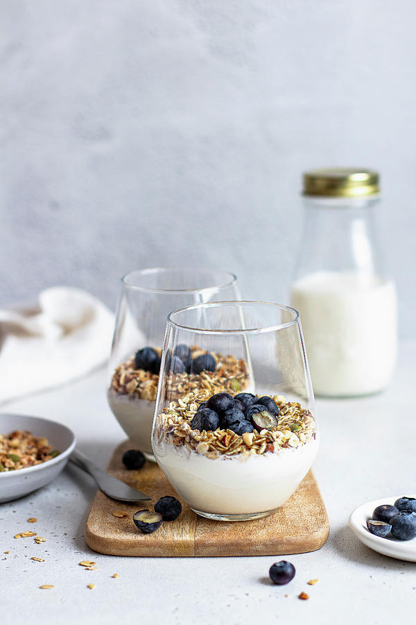 Yoghurt With Granola And Blueberries Photograph by Yulia Shkultetskaya