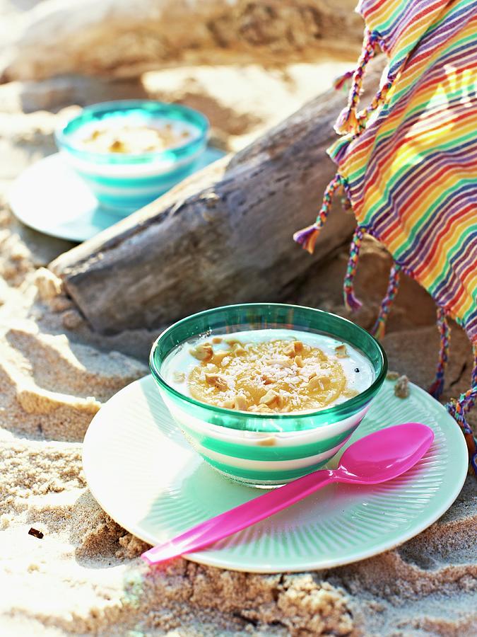 Yoghurt With Pineapple And Peanuts For A Caribbean Picnic On A Beach Photograph by Hannah Kompanik