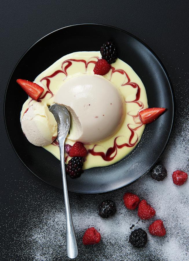 Yogurt Panna Cotta In Vanilla Sauce With Berries Photograph by Robbert Koene