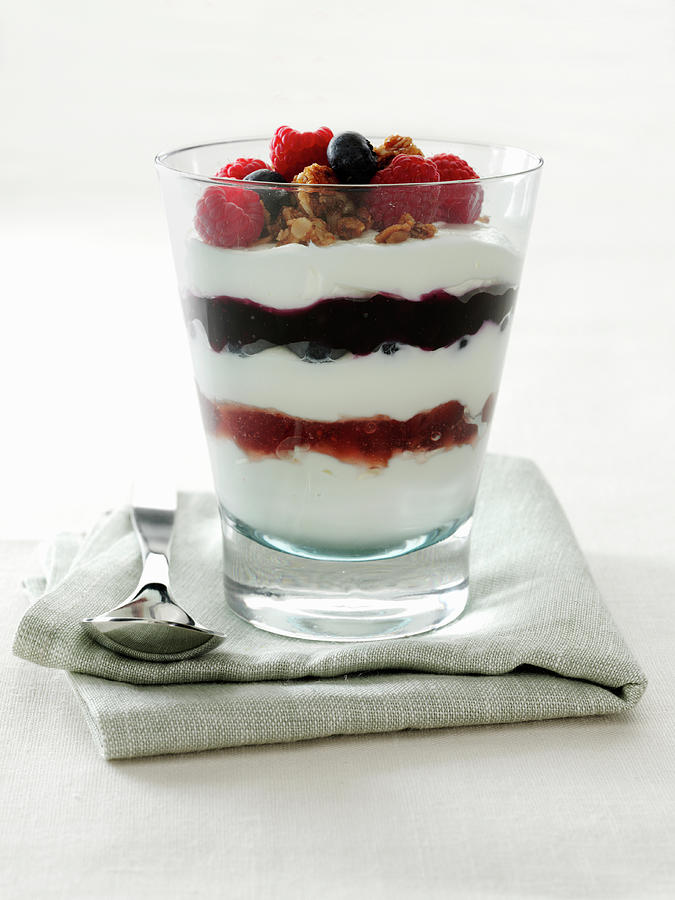 Yogurt Parfait With Raspberries And Blueberries Garnished With Candied Pecans Photograph by Albert P Macdonald