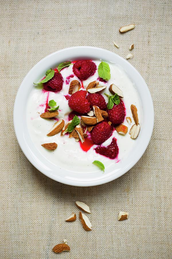 Yogurt With Raspberries And Almonds Photograph by Sporrer/skowronek